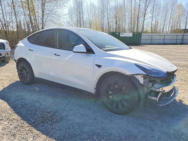 2024 TESLA MODEL Y — Passenger 3/4