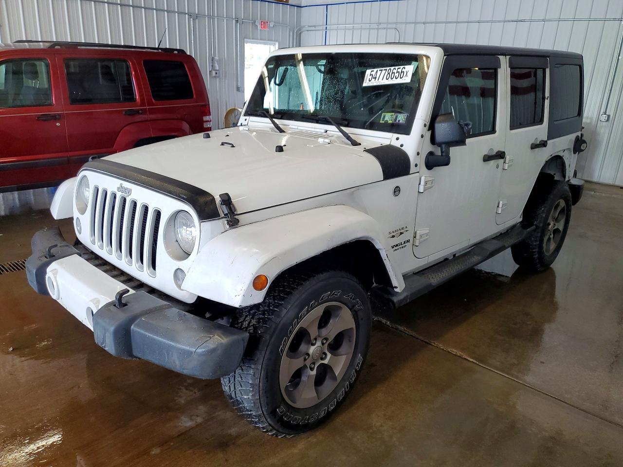 2016 JEEP WRANGLER UNLIMITED SAHARA 4X4 — Front 3/4