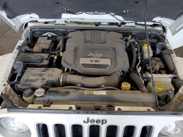 2016 JEEP WRANGLER UNLIMITED SAHARA 4X4 — Engine bay