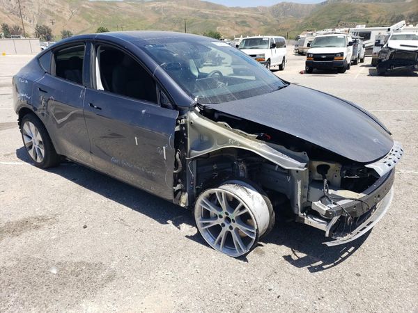 2023 TESLA MODEL Y — Passenger 3/4