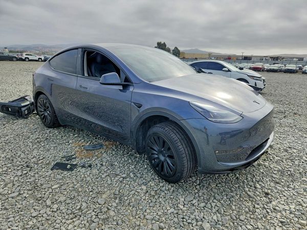 2023 TESLA MODEL Y — Passenger 3/4