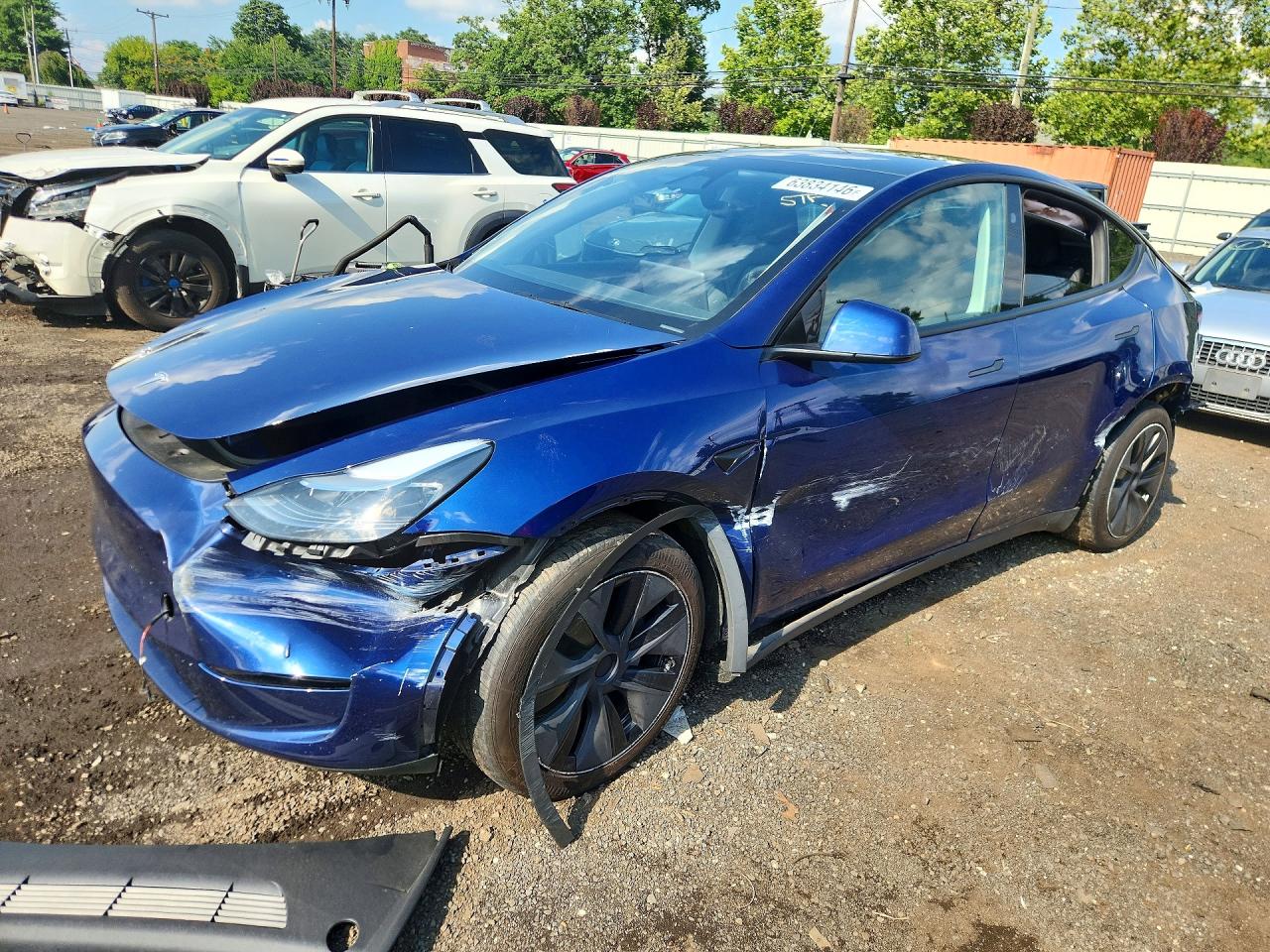 2025 TESLA MODEL Y — Front 3/4