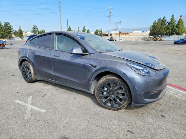 2023 TESLA MODEL Y — Passenger 3/4