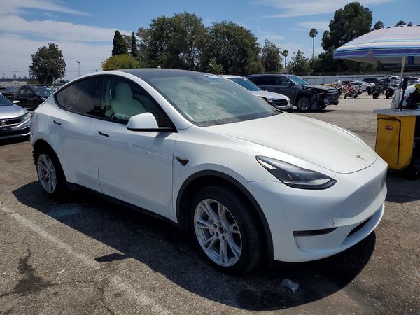 2023 TESLA MODEL Y — Passenger 3/4