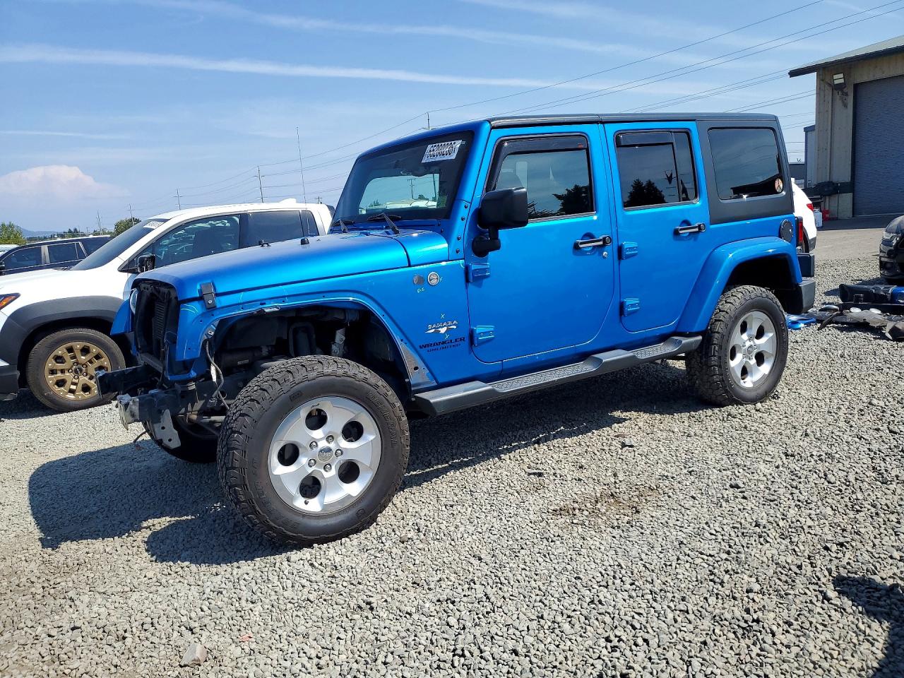 2016 JEEP WRANGLER UNLIMITED SAHARA 4X4 — Front 3/4