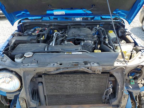 2016 JEEP WRANGLER UNLIMITED SAHARA 4X4 — Engine bay