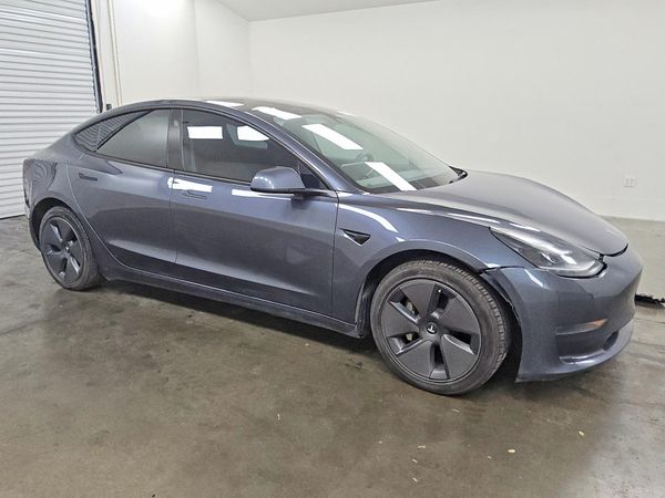 2023 TESLA MODEL 3 — Passenger 3/4