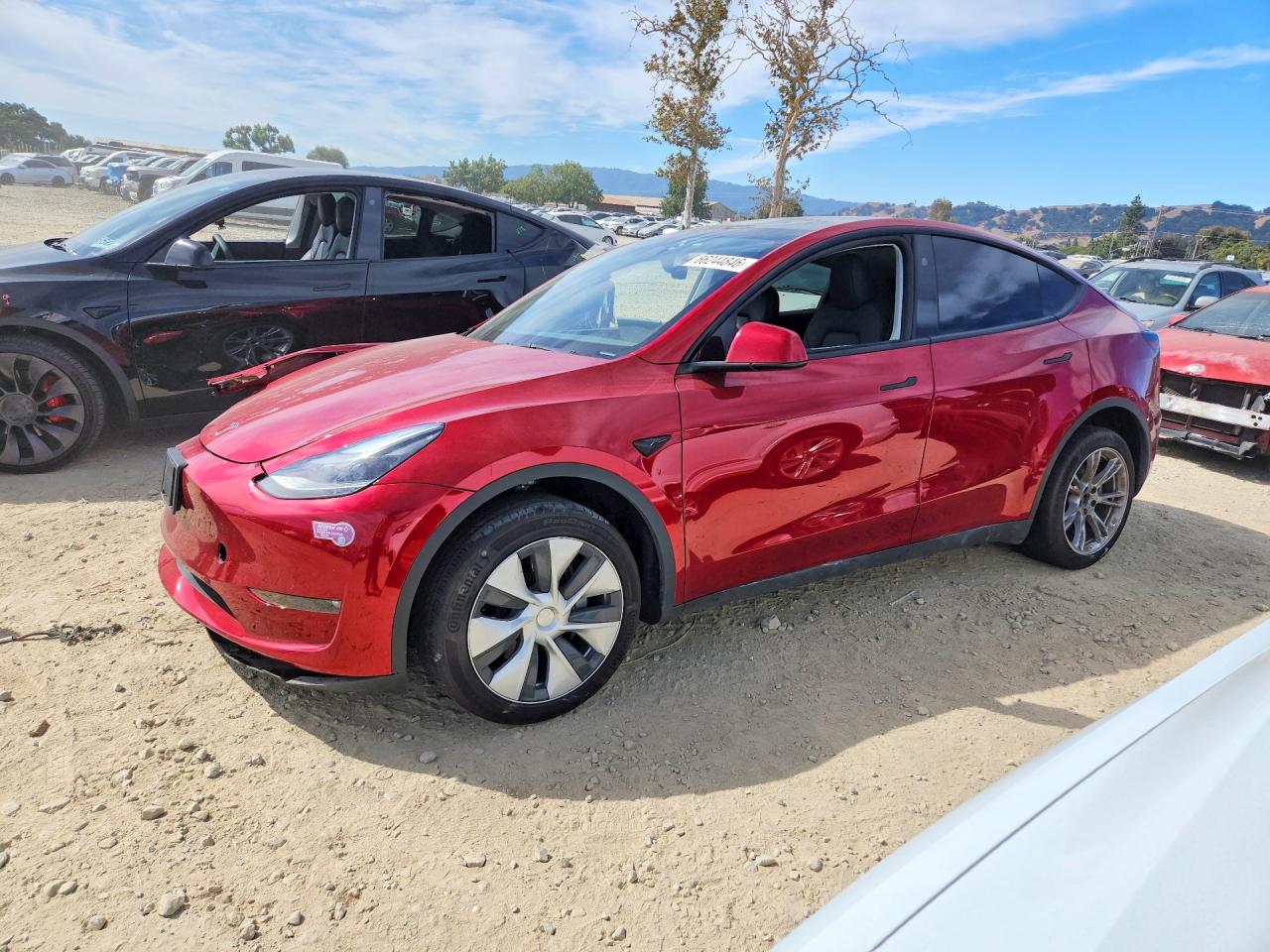 2024 TESLA MODEL Y — Front 3/4