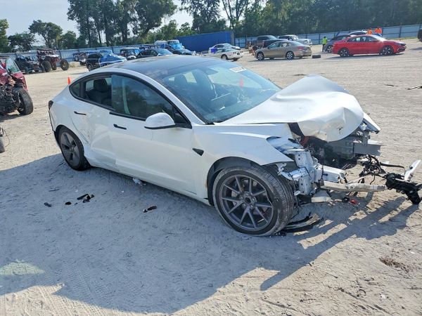 2023 TESLA MODEL 3 — Passenger 3/4