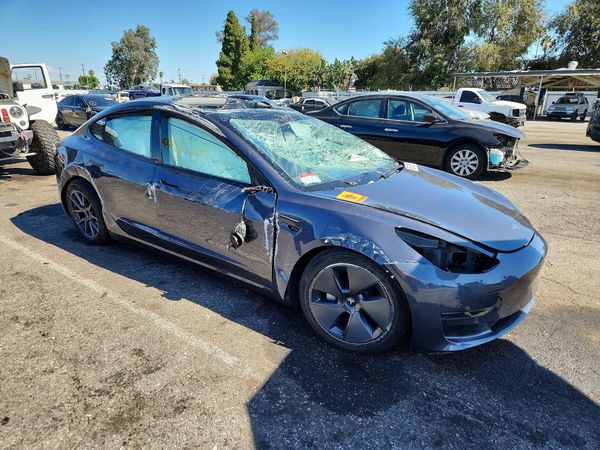 2023 TESLA MODEL 3 — Passenger 3/4