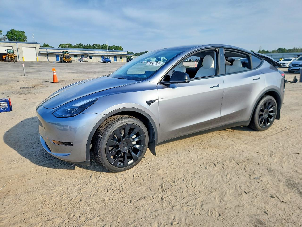 2024 TESLA MODEL Y — Front 3/4