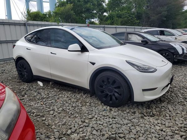 2023 TESLA MODEL Y — Passenger 3/4