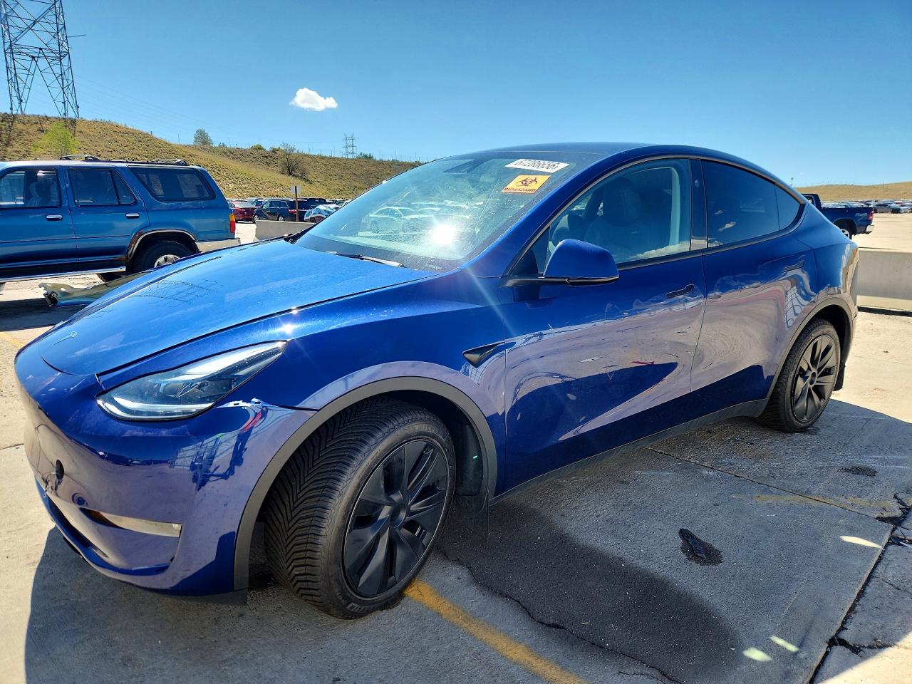 2025 TESLA MODEL Y — Front 3/4
