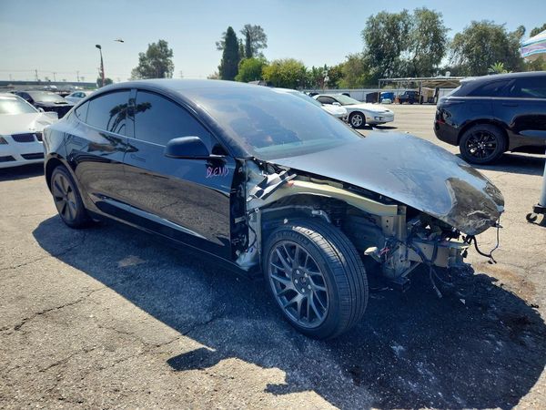 2026 TESLA MODEL 3 — Passenger 3/4