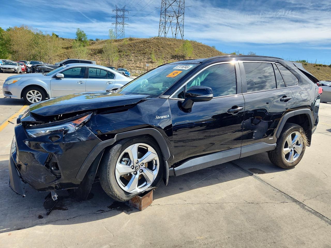 2021 TOYOTA RAV4 XLE Premium HV — Front 3/4