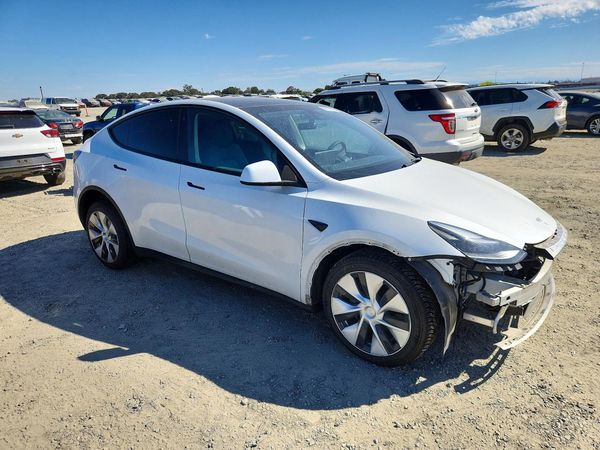 2023 TESLA MODEL Y — Passenger 3/4