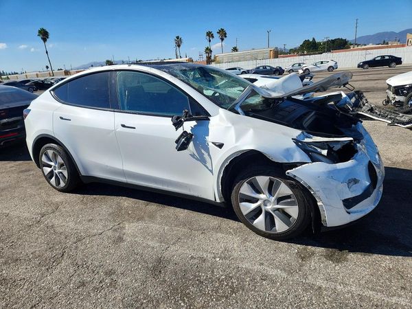 2023 TESLA MODEL Y — Passenger 3/4
