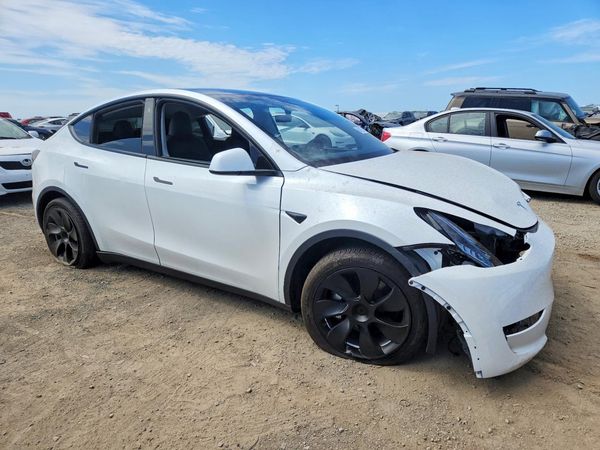 2023 TESLA MODEL Y — Passenger 3/4