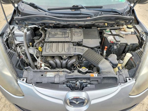 2014 MAZDA MAZDA2 — Engine bay