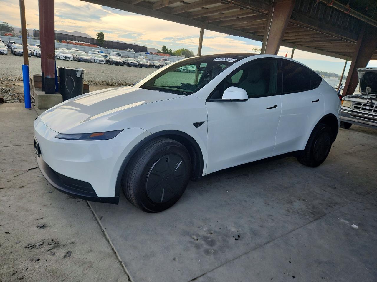 2026 TESLA MODEL Y — Front 3/4