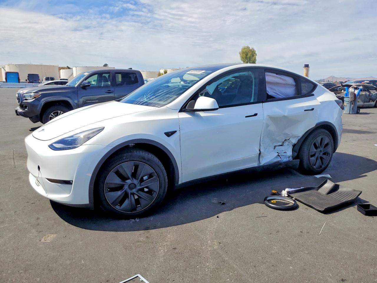 2024 TESLA MODEL Y — Front 3/4