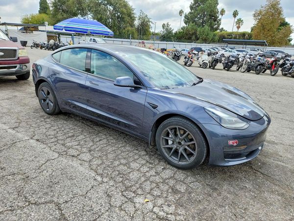 2023 TESLA MODEL 3 — Passenger 3/4