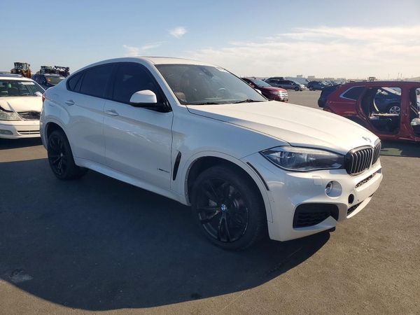 2016 BMW X6 xDrive50i — Passenger 3/4