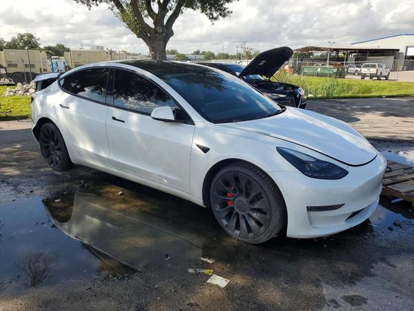 2023 TESLA MODEL 3 — Passenger 3/4