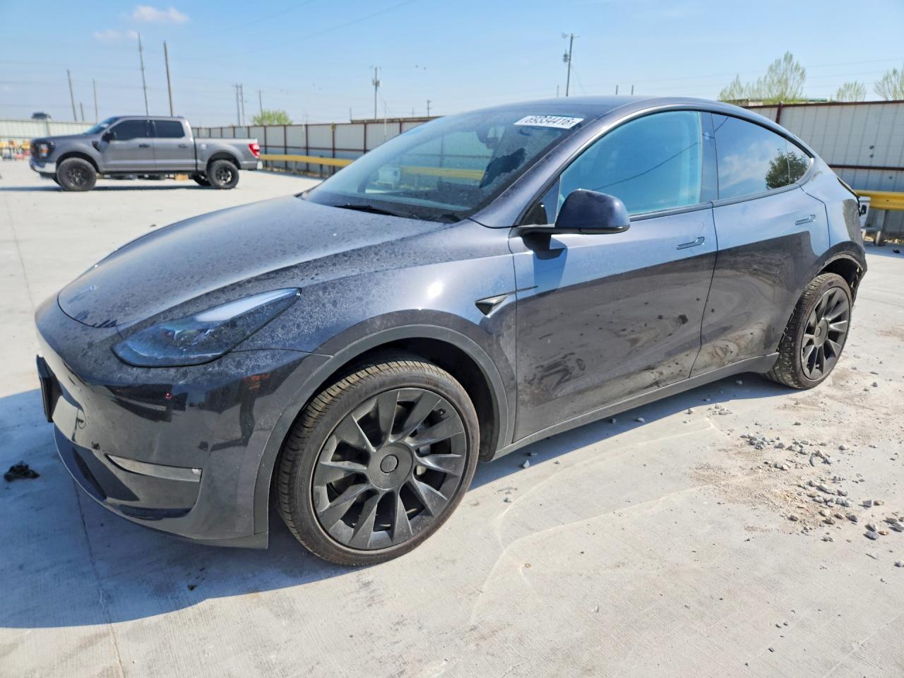 2025 TESLA MODEL Y — Front 3/4