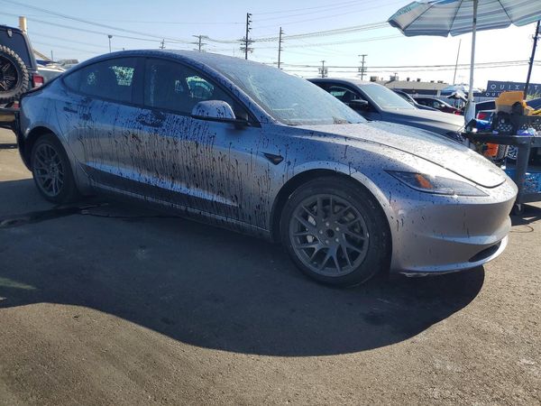2026 TESLA MODEL 3 — Passenger 3/4