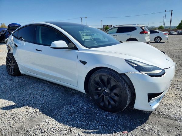 2023 TESLA MODEL 3 — Passenger 3/4