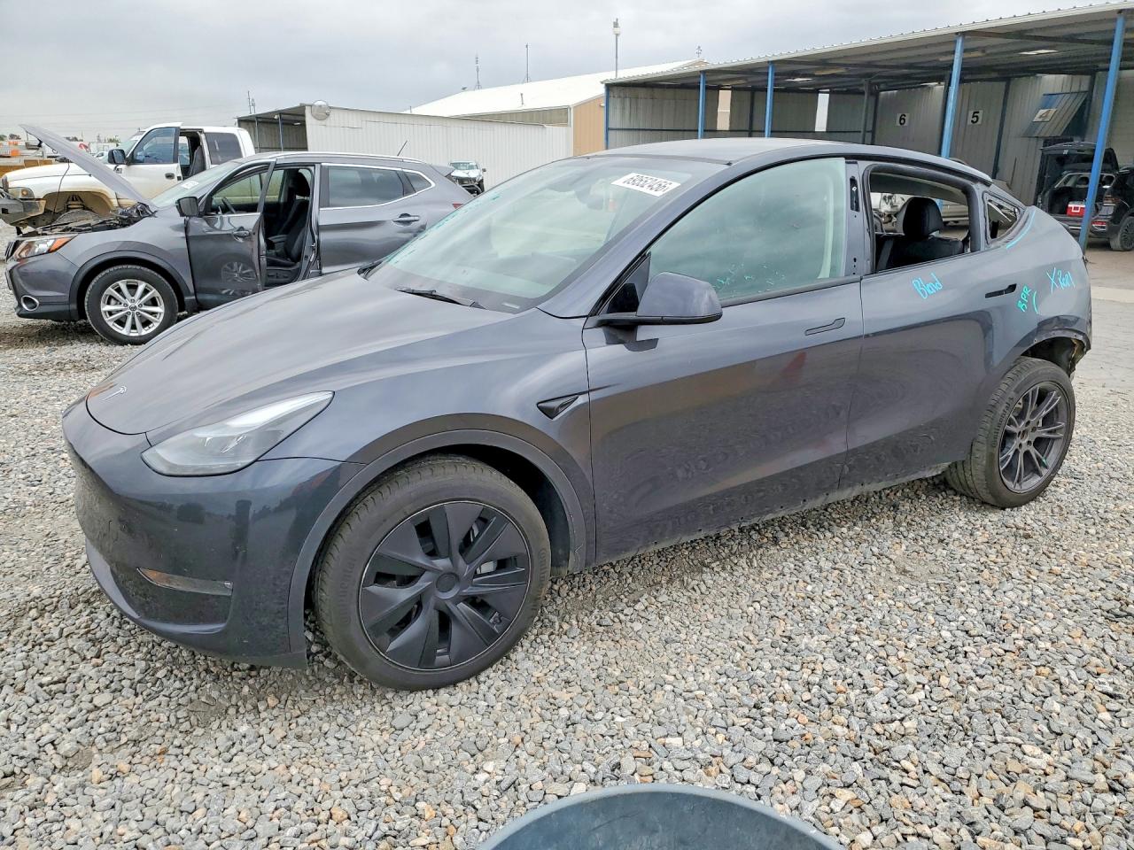 2025 TESLA MODEL Y — Front 3/4