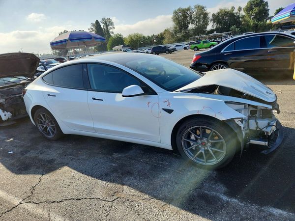 2023 TESLA MODEL 3 — Passenger 3/4