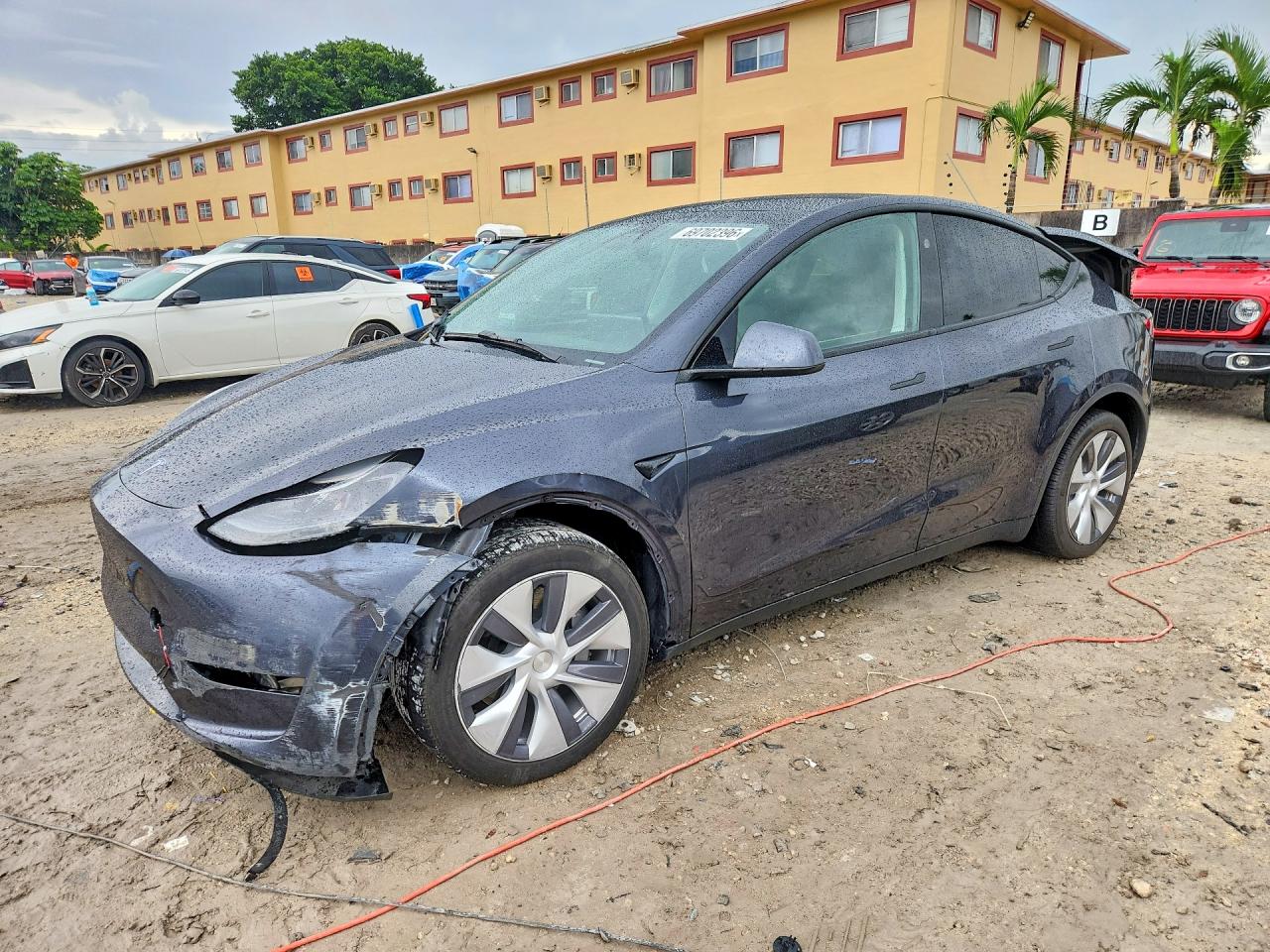 2024 TESLA MODEL Y — Front 3/4