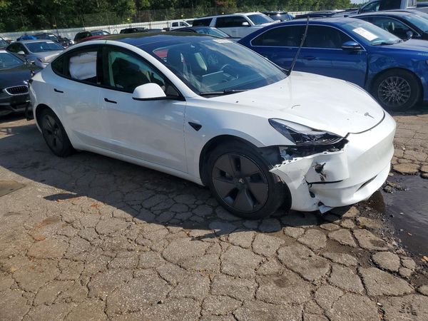 2023 TESLA MODEL 3 — Passenger 3/4