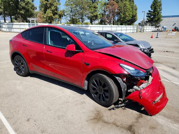 2023 TESLA MODEL Y — Passenger 3/4