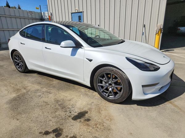 2023 TESLA MODEL 3 — Passenger 3/4