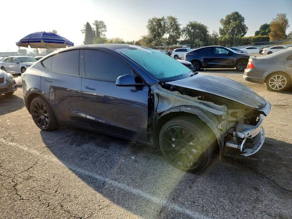 2023 TESLA MODEL Y — Passenger 3/4