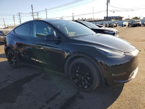 2023 TESLA MODEL Y — Passenger 3/4