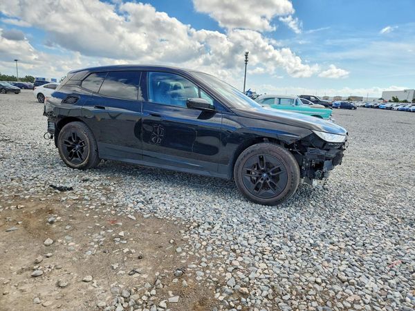 2024 BMW IX xDrive50 — Passenger 3/4