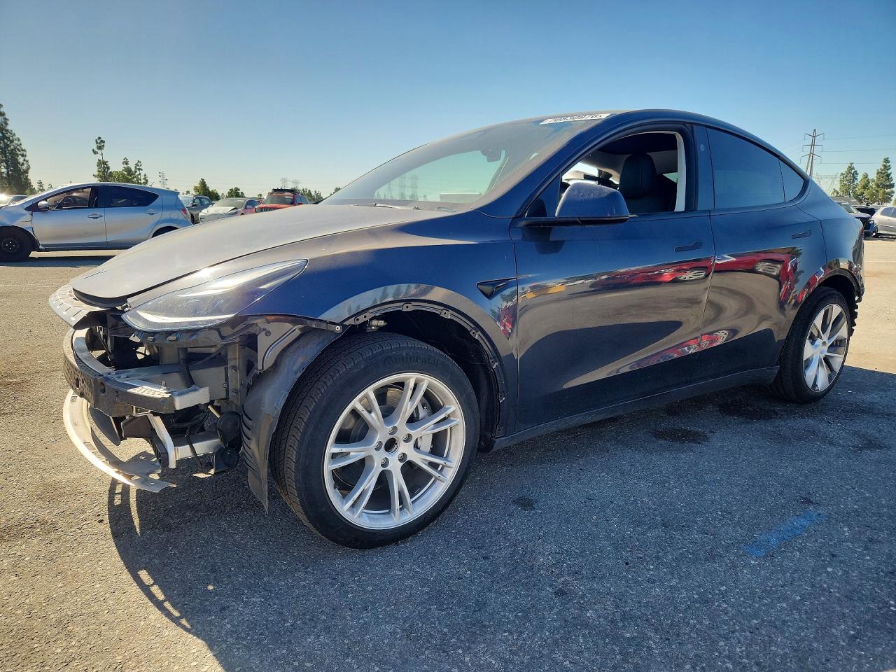 2024 TESLA MODEL Y — Front 3/4