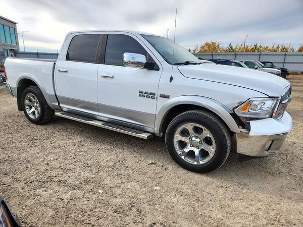 2014 RAM 1500 Laramie — Passenger 3/4
