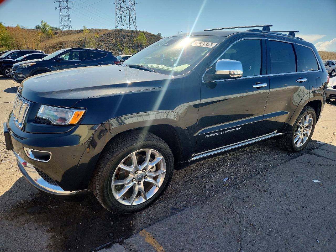 2016 JEEP GRAND CHEROKEE Summit — Front 3/4