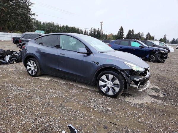 2023 TESLA MODEL Y — Passenger 3/4