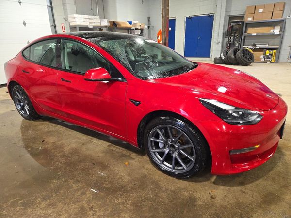 2023 TESLA MODEL 3 — Passenger 3/4