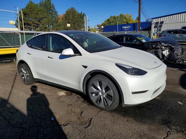 2023 TESLA MODEL Y — Passenger 3/4