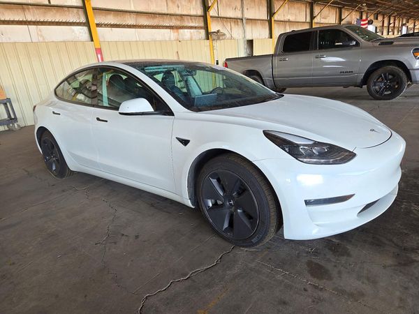 2023 TESLA MODEL 3 — Passenger 3/4