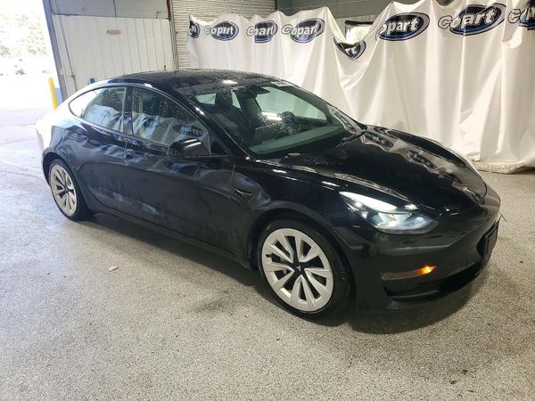 2023 TESLA MODEL 3 — Passenger 3/4