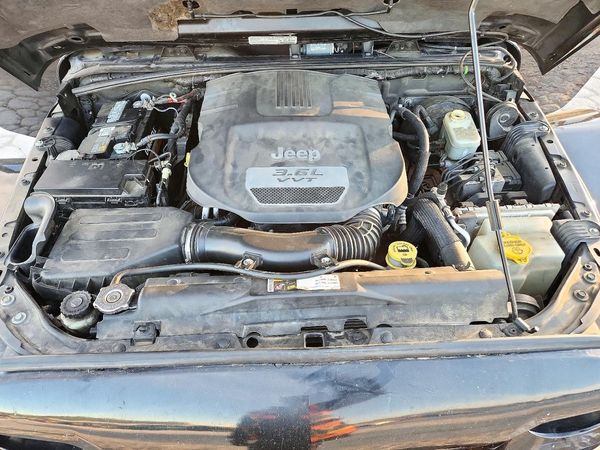 2013 JEEP WRANGLER UNLIMITED SAHARA 4X4 — Engine bay