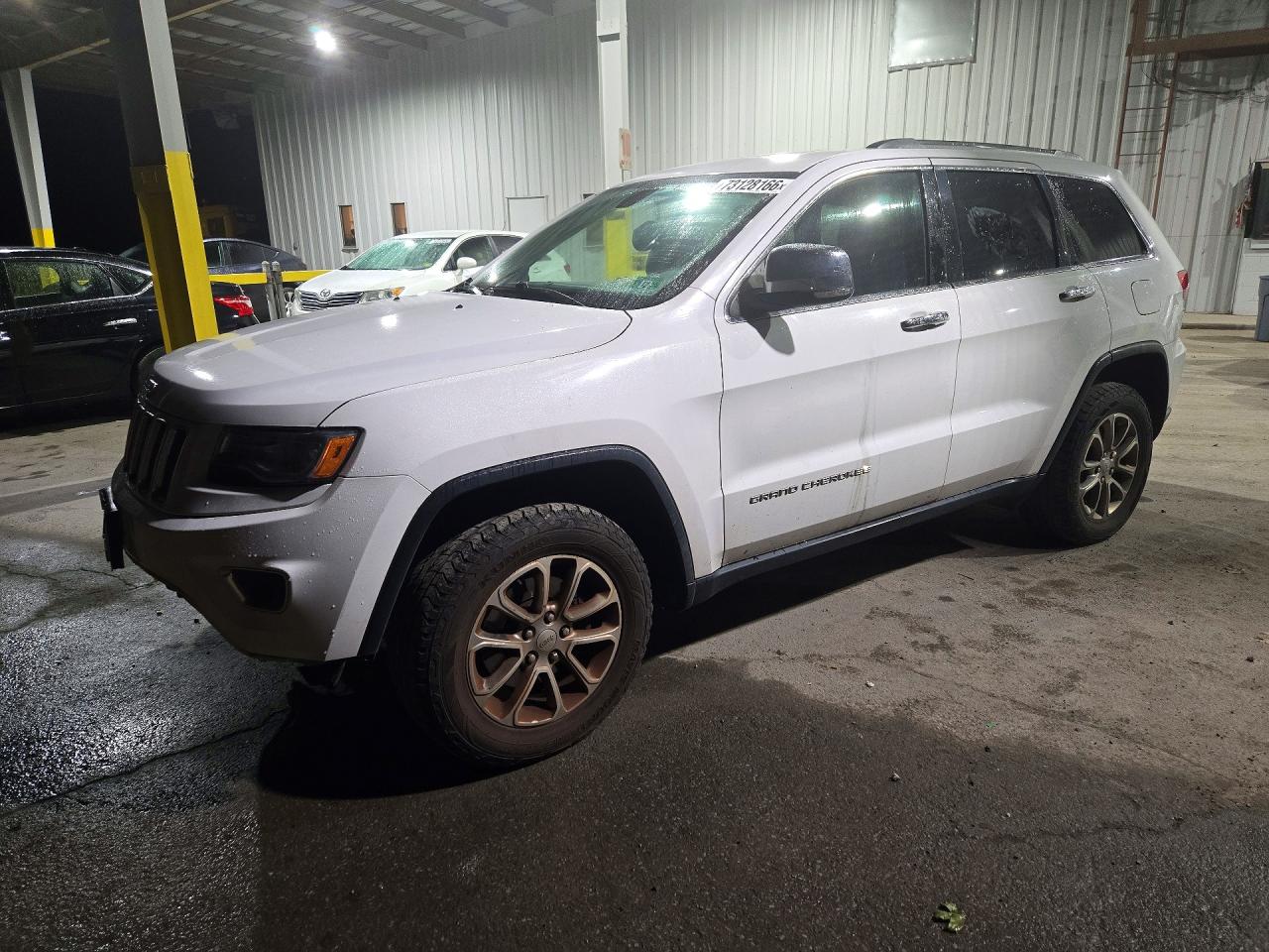 2015 JEEP GRAND CHEROKEE Limited — Front 3/4